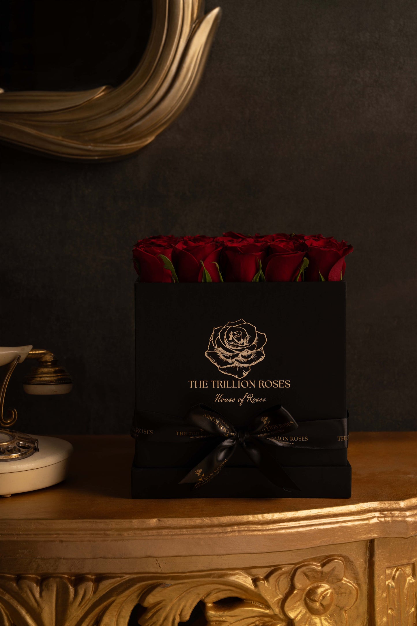 RUBY RED ROSES IN BLACK SQUARE BOX.