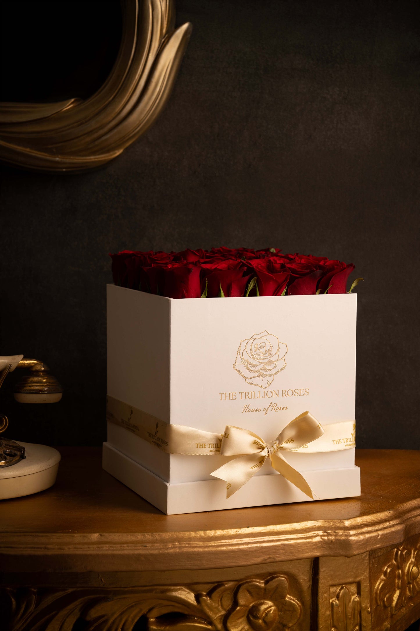 RUBY RED ROSES IN BLACK SQUARE BOX.