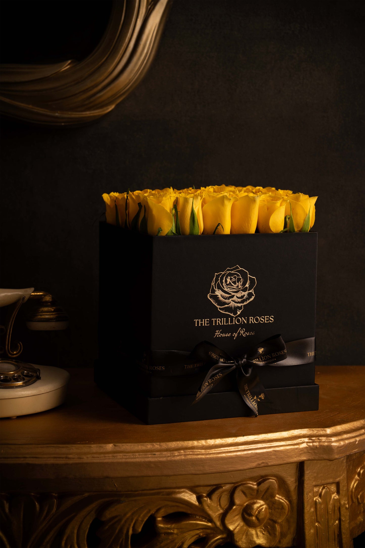 YELLOW SUNSHINE ROSES -  IN BLACK SQUARE BOX.